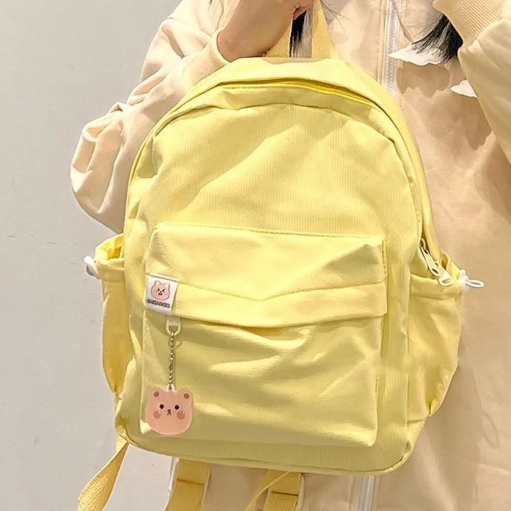 ALTALIVA Aesthetic Backpack Mini Canvas Korean Backpack with Kawaii Accessories, Laptop Lightweight Travel Backpack for Women (Yellow)